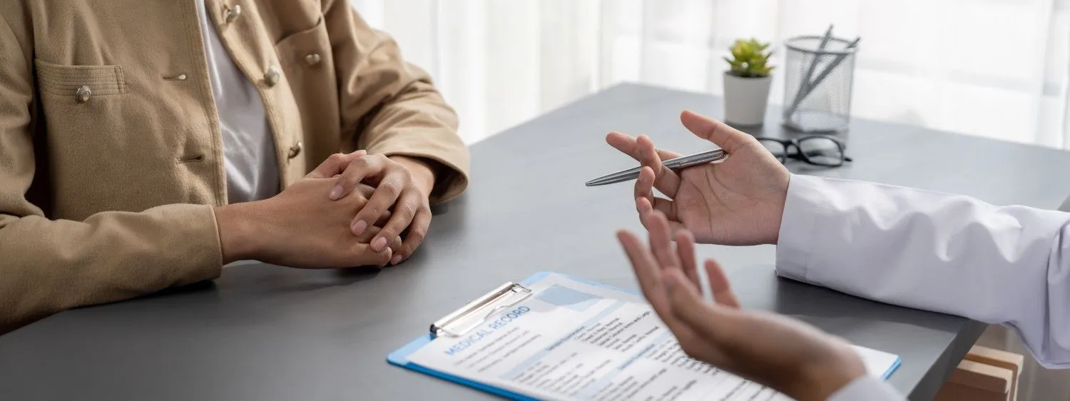 Family on a couch smiling together